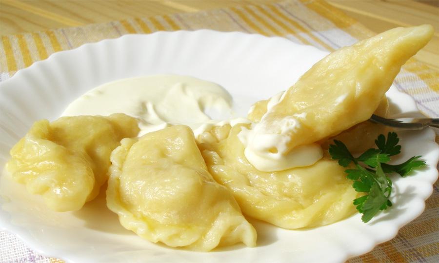 Dumplings with mushrooms and potatoes on a plate