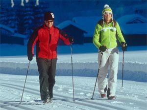 Married couple winter Nordic walking
