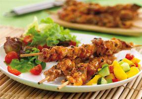 Chicken skewers with vegetables on a dish