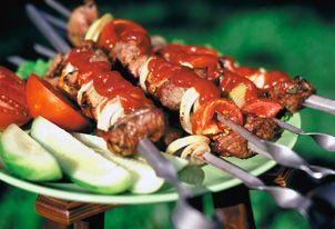 Ready-made pork skewers with cucumbers and tomatoes