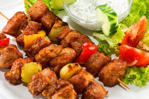 Fragrant kebab with vegetables on a dish