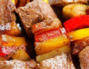 Beef skewers cooked in a slow cooker with vegetables