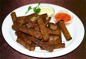 Rye bread crackers on a plate with sauce