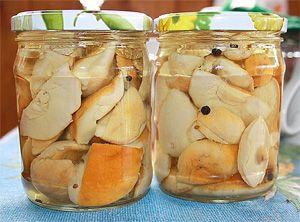 Pickled porcini mushrooms in glass jars