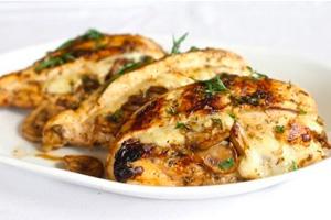 Chicken breast stuffed with mushrooms and cheese on a plate