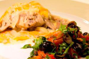 Rabbit in sour cream with prunes and vegetables