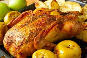 Baked chicken in the oven with apples