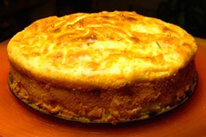 Pie with minced meat and cabbage on a dish