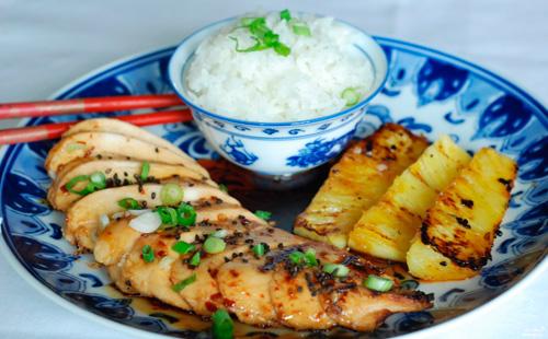 Chicken with pineapple and rice on a plate