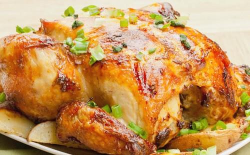 Baked chicken garnished with green onions
