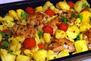Chicken thighs with potatoes and tomatoes