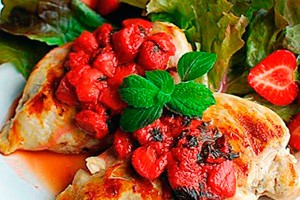 Chicken fillet with berry sauce with mint leaves