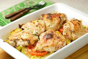 Baked chicken with potatoes and tomatoes