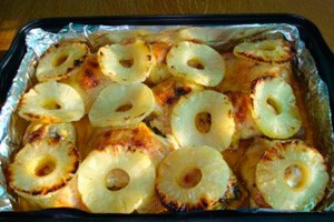 Baked chicken with pineapple on a foil