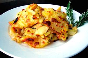 Chicken with zucchini and a sprig of rosemary