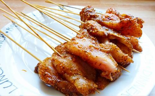 The meat on sticks looks like chicken torches