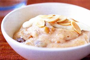 Semolina with banana slices in a white bowl