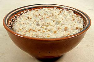 Classic wheat porridge in a clay bowl