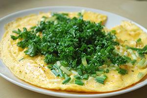 Omelette sprinkled with herbs