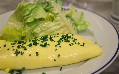 Omelet with onion and salad