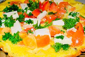 Omelet with tomatoes and soft cheese