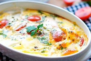 Oven baked omelet with tomatoes and cheese