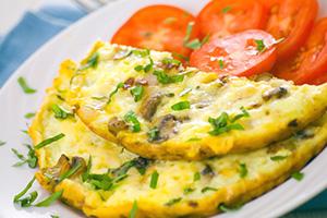 Omelet with mushrooms and tomatoes