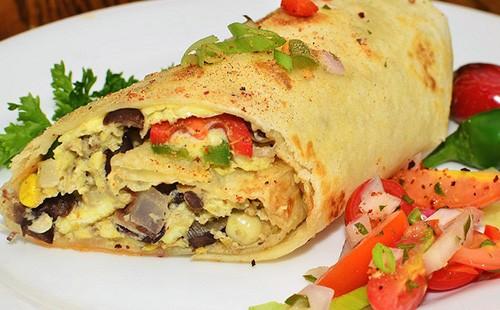 Roll omelet with mushrooms and tomatoes