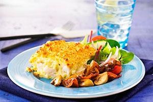 Slice of fish casserole with vegetables