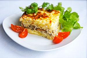 Potato casserole with mushrooms and tomatoes