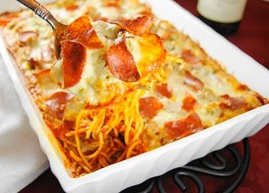 Casserole of pasta and sausage on a spoon