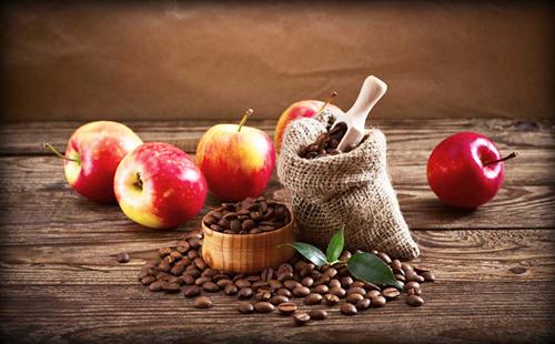 Bag of bitter coffee and red sweet apples