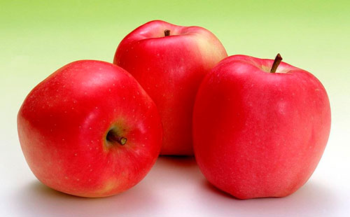 Three red apples