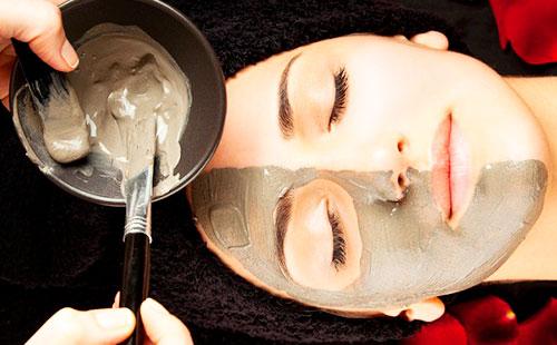 applying a gray mask to the face