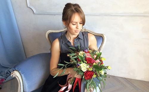 Natalia holds a big beautiful bouquet