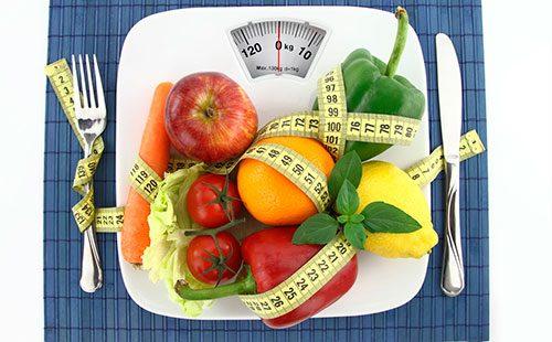 Vegetables and fruits on the scales