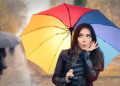 Girl in a leather jacket under an umbrella