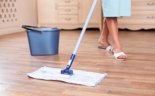 Woman mops the floor