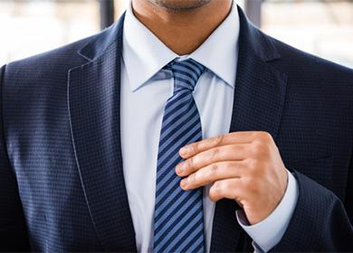 Man holding a tie