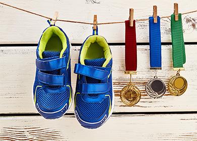 Blue sneakers hanging on a clothesline