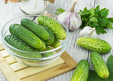 Fresh cucumbers and heads of garlic
