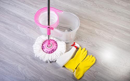 Mop, bucket and yellow gloves