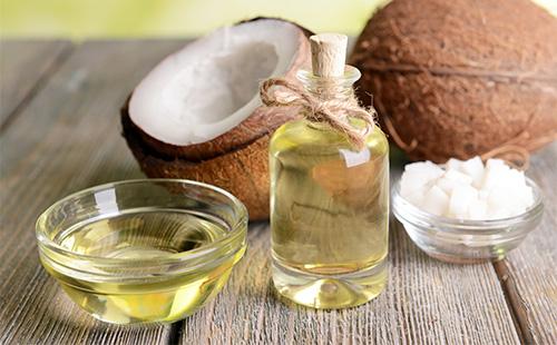 Coconut oil in a bowl and bottle