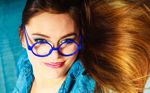 Young woman in blue glasses