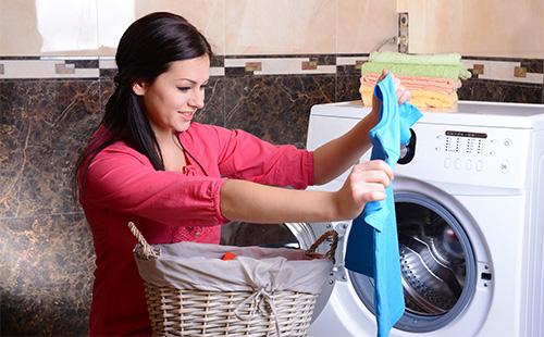 Woman examines laundry