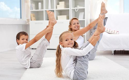 Mom with children does exercises