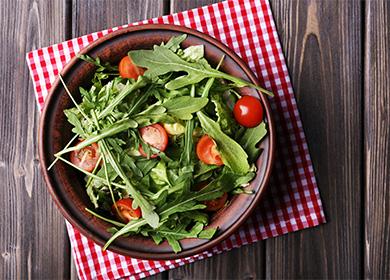 Plate with salad and arugula in a plate
