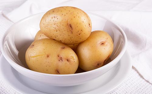 Jacket potatoes in a white plate