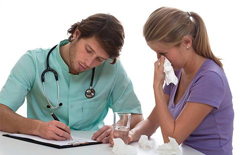 A doctor prescribes a medicine for a patient