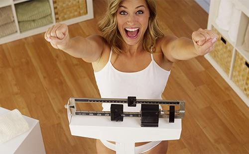 Girl rejoices on the scales